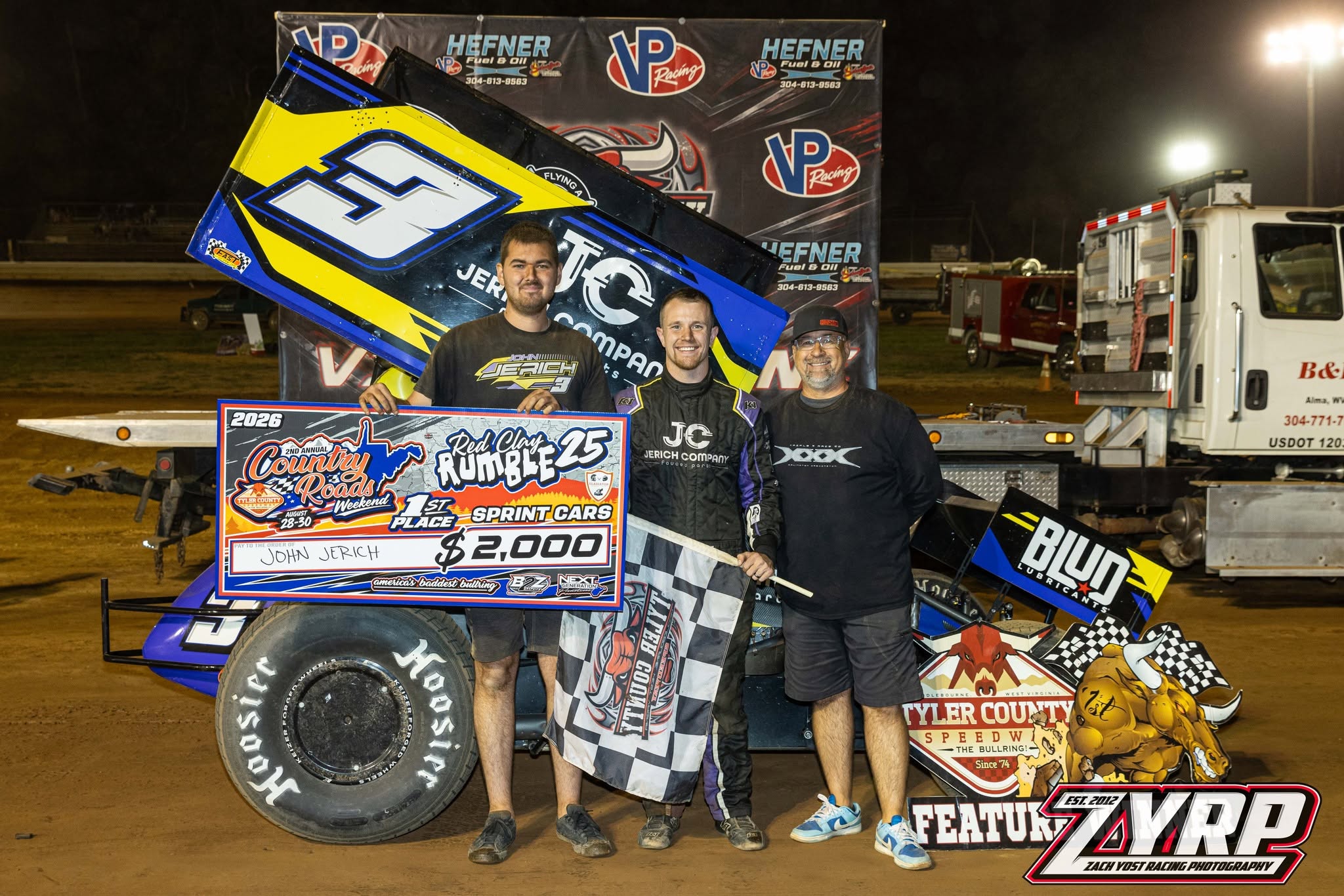 Victory lane at Tyler County Speedway with the Red Clay Rumble 25 winner's check